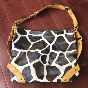 Cow print bag in used condition.
